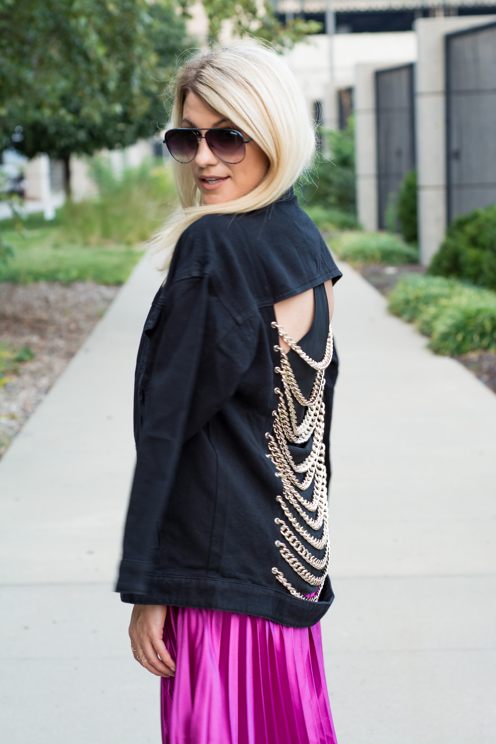 Fuchsia Pleated Midi Skirt + Black Denim Chain Jacket. | Ashley from LSR