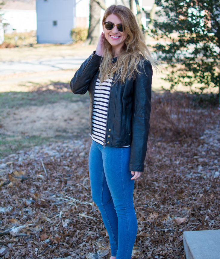 Ashley from LSR in a stripe tee, leather jacket, and gold cap toe suede pumps